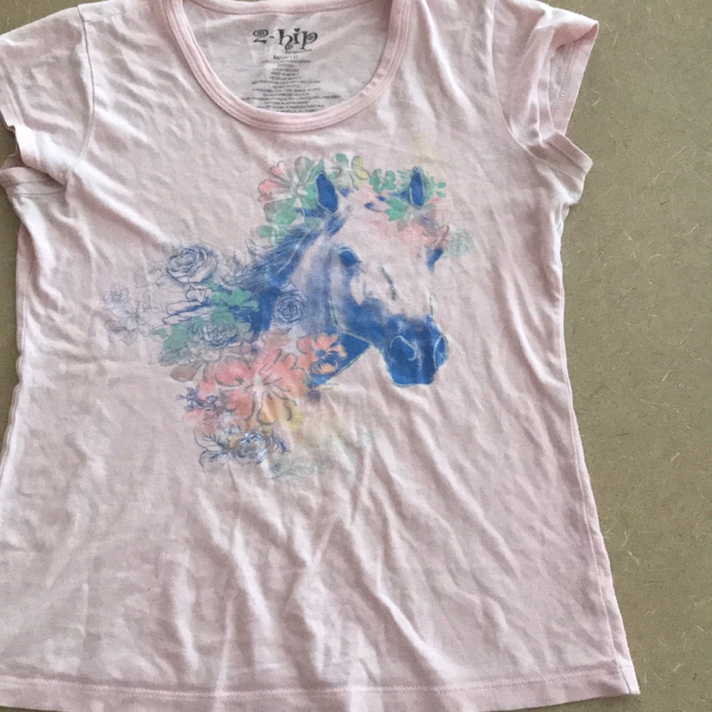 Graphic tee for girls with a unicorn on it.